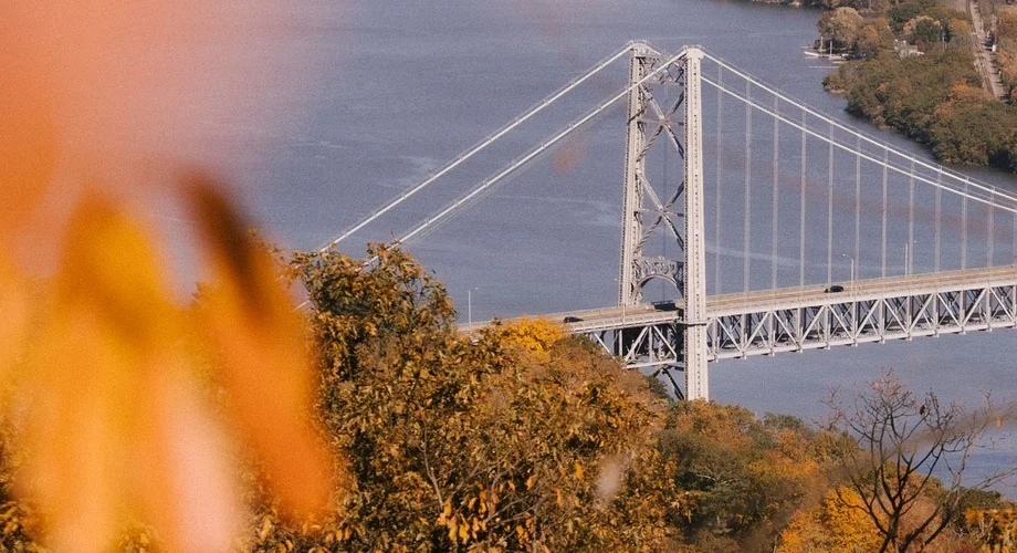 Hudson River bridge framed by fall foliage near Yonkers